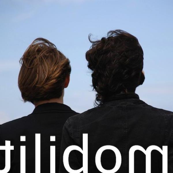 book cover says "mobilit," on an image of the back of 2 male heads.